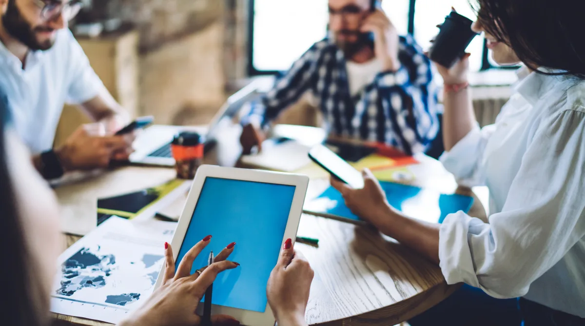 Mobile optimization Burlington Ontario showing professionals using tablets and smartphones for responsive web design testing and mobile SEO analysis