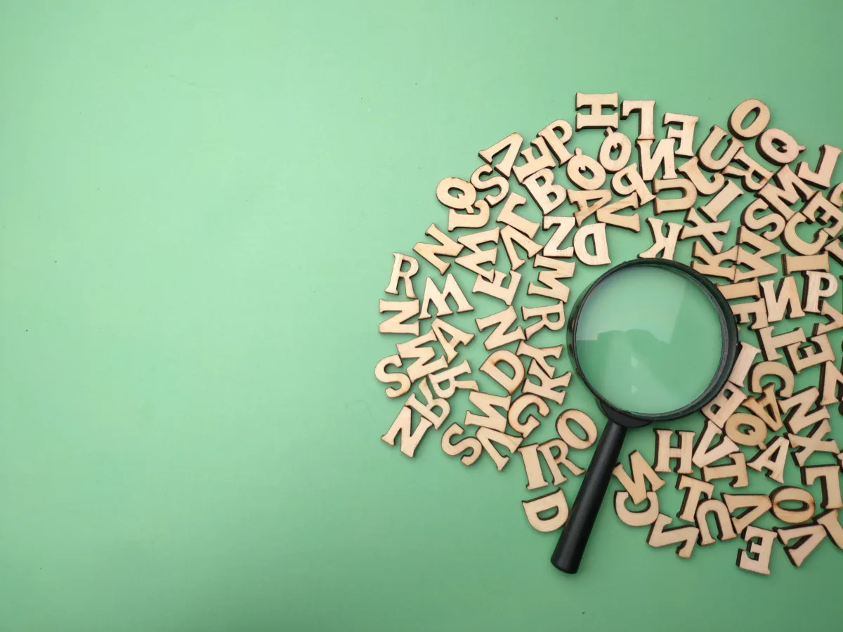 Keyword research with magnifying glass on green background